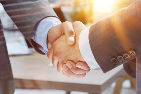 Businessman handshake for teamwork of business merger and acquisitionの写真素材
