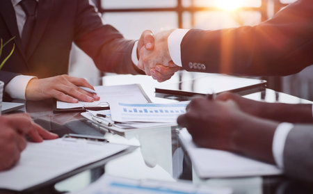 Business handshake between colleagues. close-up. Inside is a modern bright office.の写真素材