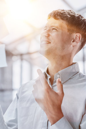 Businessman, sticky notes and work schedule for project planningの写真素材
