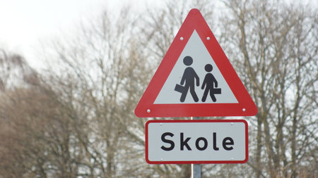 Danish sign telling that school is ahead, so look out for kidsの写真素材