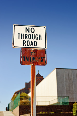 No through road sign and railway st sign on sunny dayの写真素材