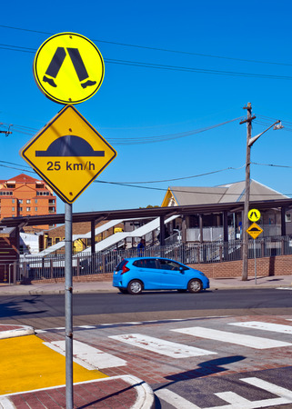 Walk and Hump sign on circular and rectangular metal-board against skyの写真素材