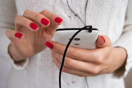 inclusion and listening to music with headphones on your smartphoneの写真素材