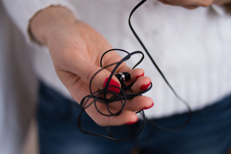 inclusion and listening to music with headphones on your smartphoneの写真素材