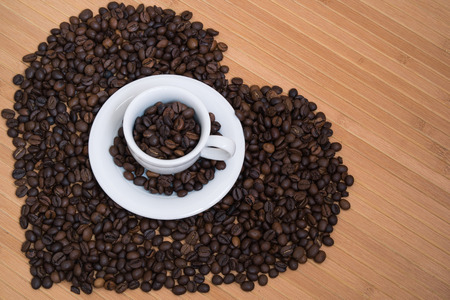 Heart shape made from coffee beansの写真素材