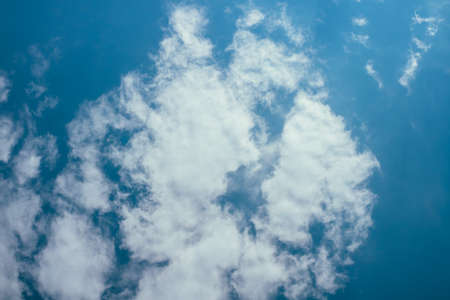 Blue sunny sky with cloudsの写真素材