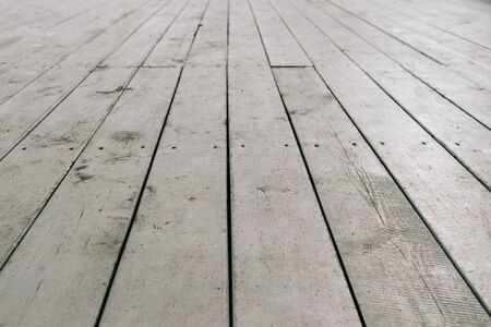 Old white wooden planks on the floorの写真素材