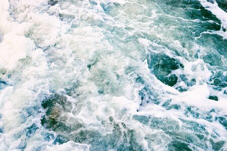 Top view of the sea waves and foam in a storm, vintage photoの写真素材