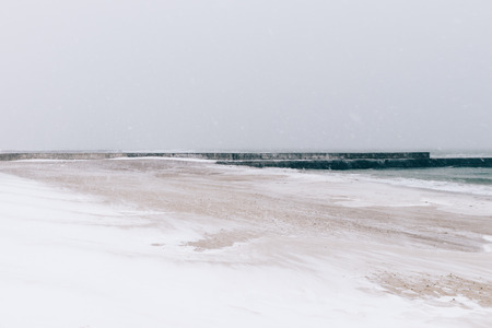 Beach during a blizzard and snowfall, minimalist landscape, soft focusの写真素材