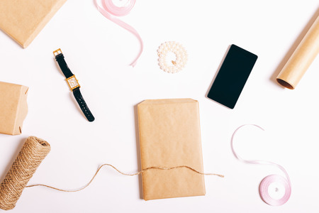 Wrapping gifts on a white table top viewの写真素材
