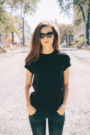 Slender girl with long hair in sun glasses outdoors in the summerの写真素材