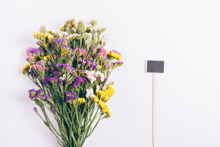 Lush bouquet of bright flowers on a white background close-upの写真素材