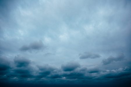 Dark cloudy stormy sky, thunderstorm approaching.の写真素材