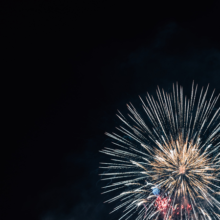 Festive round fireworks in black night sky, copy space.の写真素材