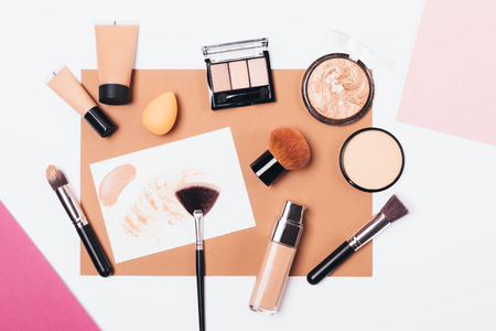 Decorative cosmetics, brushes and sponges to create smooth complexion and sculpting, flat lay composition.の写真素材