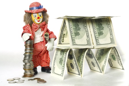 Clown with chinks near a dollar houseの写真素材