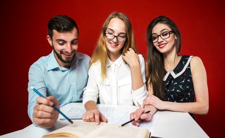 A group of young attractive students have a friendly discussion, teamwork student concept