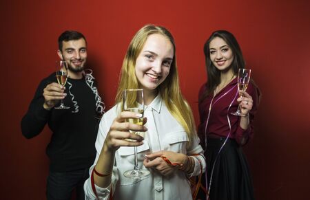 Friends on a New Year party have fun, friendly celebrationの写真素材