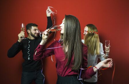 Friends on a New Year party have fun, friendly celebrationの写真素材