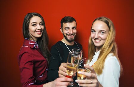 Friends on a New Year party have fun, friendly celebrationの写真素材