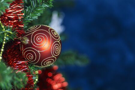 Decorated Chraistmas Tree, red ball with blue backgroundの写真素材