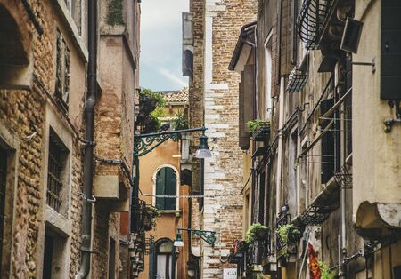 Venice, Italy - Aug 25, 2018: Venice street exterior with old buildingsのeditorial素材
