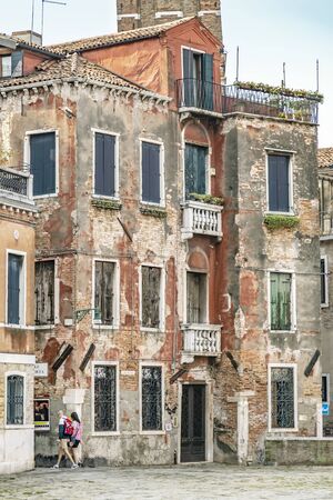 VENICE, ITALY - 25 August, 2018: Beautiful and colorful houses at Venice city with blue sky and cloudのeditorial素材