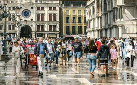VENICE, ITALY - 25 August, 2018: Historic venecian square with tourists and locals
