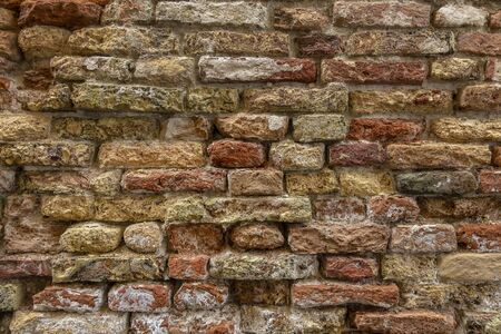 Red old worn brick wall texture backgroundの写真素材