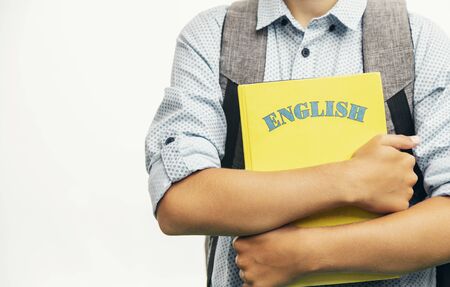 Kid with schoolbag and English books closeupの写真素材