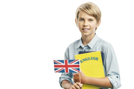 Smiling kid holding British flag and English booksの写真素材