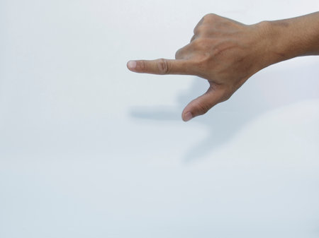 Man hand pointing on white background. Isolated on white background.の写真素材