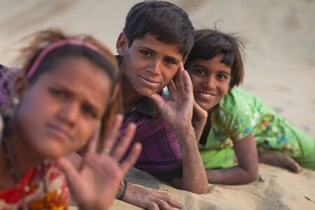 JAISALMER  DECEMBER 10 : Young Rajasthani kids in desert on December 10, 2010. About 40% of the total population of Rajasthan state live in the Thar desertのeditorial素材