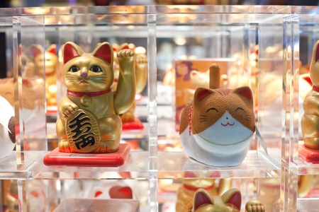 many maneki neko or beckoning cat in a window in Asiaのeditorial素材