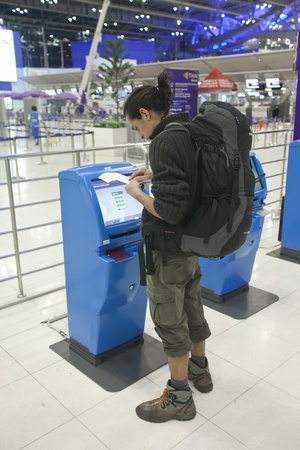 BANGKOK Ð JANUARY 17. Passenger completing web check-in at Bangkok airport on January 17, 2012. Suvarnabhumi airport is worldのeditorial素材