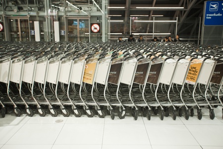 BANGKOK Ð JANUARY 17. Stacked empty trolleys in early morning Bangkok airport on January 17, 2012. Suvarnabhumi airport is worldのeditorial素材