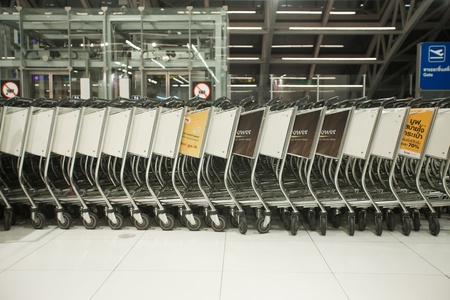 BANGKOK Ð JANUARY 17. Stacked empty trolleys in early morning Bangkok airport on January 17, 2012. Suvarnabhumi airport is worldのeditorial素材