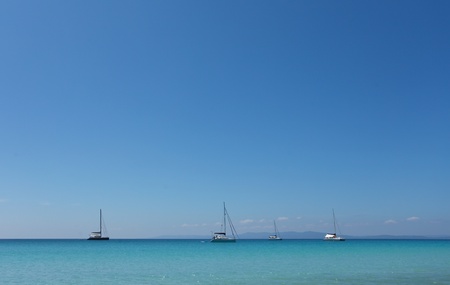 four boats anchored in front of Radha nagar beach on Havelock island, Indiaの写真素材
