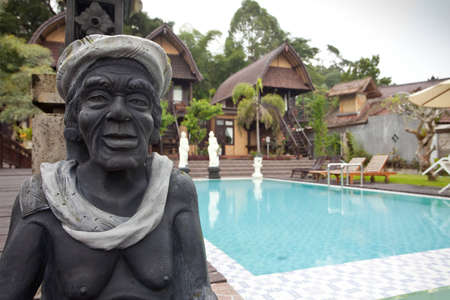 Nature resort with pool and statue on Lake Batur in Bali, Indonesia.のeditorial素材