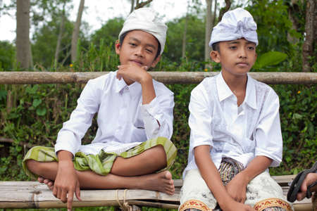 BALI - JANUARY 22. Balinese pilgrim children at Mother Temple in Besakih on January 22, 2012 in Bali, Indonesia. Most Balinese hindus make a yearly pilgrim to the mother of all temples.のeditorial素材