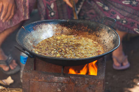 BALI - FEBRUARY 11. Villagers prepare food for wedding ceremony on February 11, 2012 in Bali, Indonesia. This fishing village community eat mostly pork.のeditorial素材
