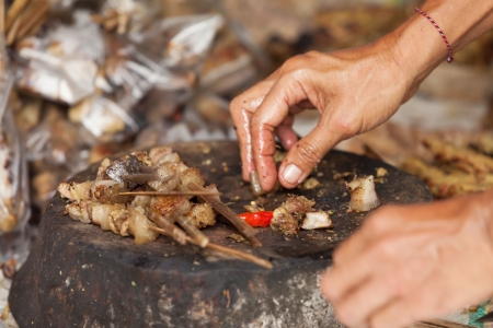 BALI - FEBRUARY 11. Villagers prepare food for wedding ceremony on February 11, 2012 in Bali, Indonesia. This fishing village community eat mostly pork.のeditorial素材