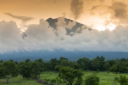 Sunset over Volcano Gunung Agung, Bali's highest peak.の写真素材