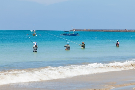 BALI - FEBRUARY 13. Line fishermen on Jimberan beach on February 13, 2012 in Bali, Indonesia. Local fishermen find it harder to make a living due to a lack of fish caused by industrial fishing.のeditorial素材