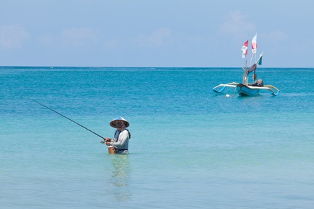BALI - FEBRUARY 13. Line fishermen on Jimberan beach on February 13, 2012 in Bali, Indonesia. Local fishermen find it harder to make a living due to a lack of fish caused by industrial fishing.のeditorial素材