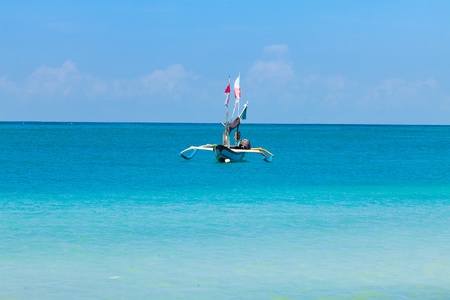 Traditional fishing boat on Jimberan beach in Bali, Indonesia.の写真素材