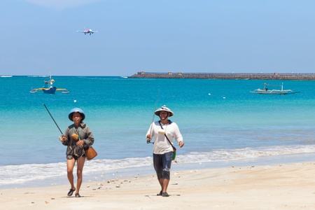 BALI - FEBRUARY 13. Landing planes Jimberan airport beach on February 13, 2012 in Bali, Indonesia. In 2011, the airport's terminals handled 11.1 million passengers a year.のeditorial素材