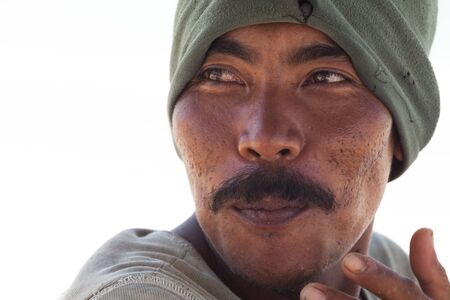 BALI - FEBRUARY 13. Portrait of line fisherman on Jimberan beach on February 13, 2012 in Bali, Indonesia. Local fishermen find it harder to make a living due to a lack of fish caused by industrial fishing.のeditorial素材