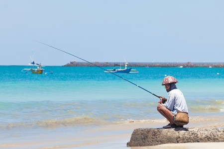 BALI - FEBRUARY 13. Line fishermen on Jimberan beach on February 13, 2012 in Bali, Indonesia. Local fishermen find it harder to make a living due to a lack of fish caused by industrial fishing.のeditorial素材
