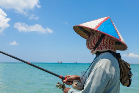 BALI - FEBRUARY 13. Line fishermen on Jimberan beach on February 13, 2012 in Bali, Indonesia. Local fishermen find it harder to make a living due to a lack of fish caused by industrial fishing.のeditorial素材